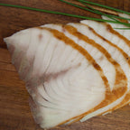 Störfilet in Scheiben geräuchert – Nahaufnahme einer Scheibe
