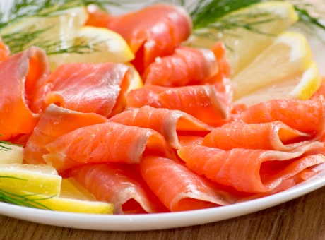 Salmon trout filet in slices, cold-smoked