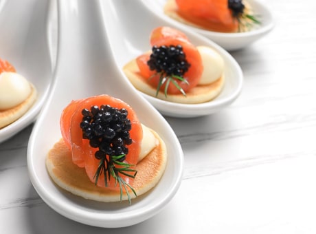 Truffle mini blinis with caviar and caviar